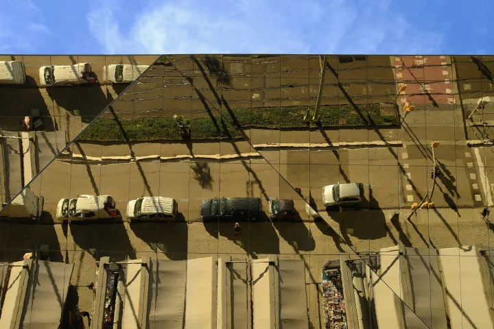 The mirrored ceiling of Mercat dels Encants reflecting the stalls and aisles of the market