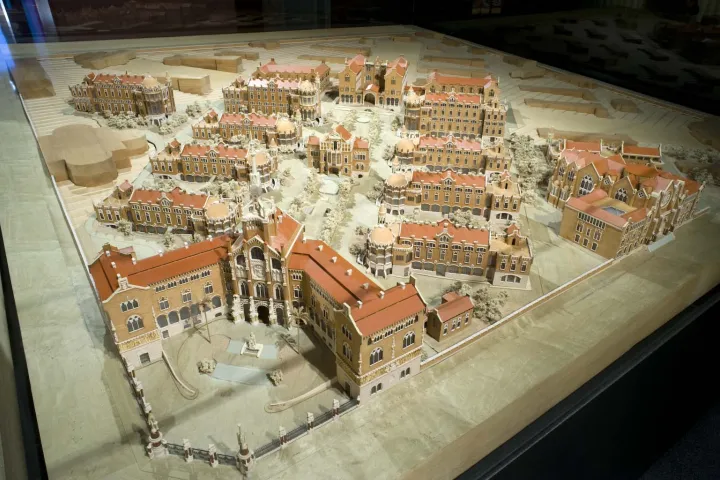 A model under glass of the modernist pavilions of Sant Pau, featuring their red-tiled roofs