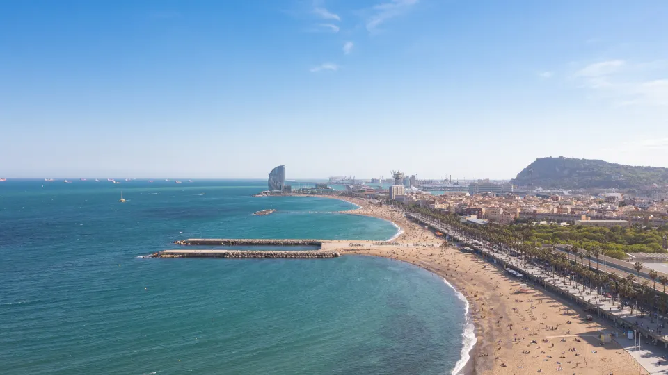 Barcelona's coastline from above: the seaside promenade, Somorrostro Beach, the W Hotel, and Montjuïc in the background