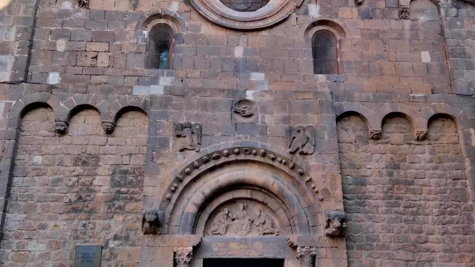 The Romanesque west façade of Sant Pau del Camp, its rose window, its round-arched portal, and its Lombard arcature frieze