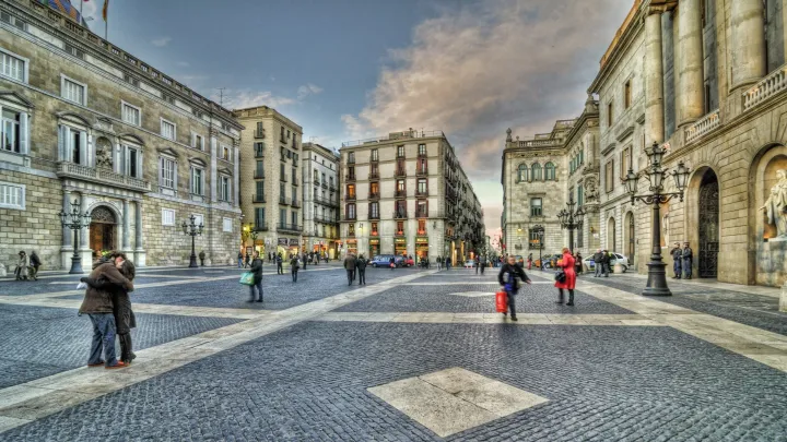 Plaça Sant Jaume viewed from its center, with the City Hall on one side and the Palau de la Generalitat on the other, facing each other